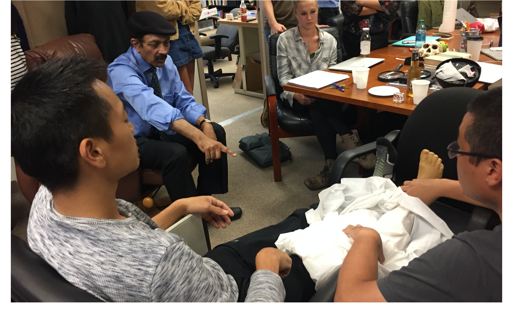 Albert Lin working with V.S. Ramachandran using mirror-visual feedback to treat Dr. Lin's phantom-limb pain.